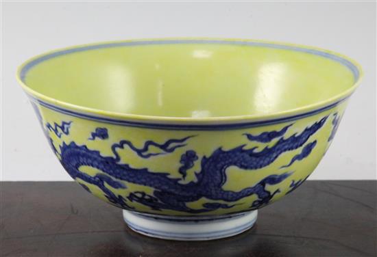 A Chinese yellow ground dragon and phoenix bowl, Xuande six character mark and possibly of the period, 19.5cm, museum restoration, sc